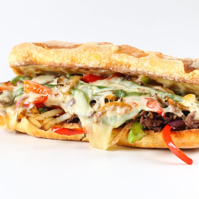 Cheese Steak, French Fries and Can Soda.